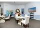Relaxing community room with seating area and glass-top table at 10764 70Th Ave # 1303, Seminole, FL 33772