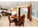 Kitchen and dining area with a breakfast bar and four chairs at 10764 70Th Ave # 1303, Seminole, FL 33772