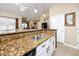 Modern kitchen with granite countertops and white cabinets at 10764 70Th Ave # 1303, Seminole, FL 33772