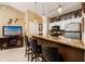Open concept kitchen with granite countertops and breakfast bar at 10764 70Th Ave # 1303, Seminole, FL 33772