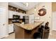 Kitchen with granite countertop and white cabinets at 10764 70Th Ave # 1303, Seminole, FL 33772