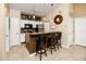 Modern kitchen with granite countertops and breakfast bar at 10764 70Th Ave # 1303, Seminole, FL 33772