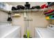 Laundry room with washer, dryer, and ample shelving for storage at 10764 70Th Ave # 1303, Seminole, FL 33772