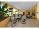 Community patio with covered seating and lush landscaping at 10764 70Th Ave # 1303, Seminole, FL 33772