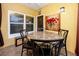 Sunroom with round table and four chairs, perfect for relaxing at 10764 70Th Ave # 1303, Seminole, FL 33772
