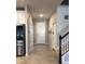 Bright and spacious entryway with tile flooring and access to kitchen and stairs at 10913 Kidron Valley Ln, Tampa, FL 33625