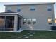 Two-story house with screened porch and backyard at 10913 Kidron Valley Ln, Tampa, FL 33625
