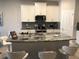 Modern kitchen featuring granite countertops and stainless steel appliances at 10913 Kidron Valley Ln, Tampa, FL 33625