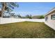 Large backyard with grassy lawn and privacy fence at 12290 68Th St, Largo, FL 33773