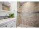 Clean bathroom with a walk-in shower and modern vanity at 13901 Bardmoor Pl # A, Tampa, FL 33618