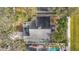 Aerial view showing house, backyard, and pool at 14721 Condor Pass, Clearwater, FL 33760