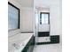 Bathroom with soaking tub, shower, and dark tile at 14721 Condor Pass, Clearwater, FL 33760