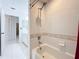 Bathroom with tub and shower, vanity, and tile floor at 14721 Condor Pass, Clearwater, FL 33760