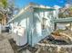 House exterior showing side yard and pond at 14721 Condor Pass, Clearwater, FL 33760