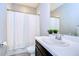 Simple bathroom with white vanity and a white shower curtain at 17721 Bright Wheat Dr, Lithia, FL 33547