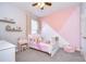 Charming bedroom with a pink accent wall and Disney princess bedding at 17721 Bright Wheat Dr, Lithia, FL 33547