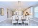 Bright dining room with farmhouse table and chandelier at 17721 Bright Wheat Dr, Lithia, FL 33547