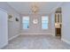 Elegant dining room featuring hardwood floors and a chandelier at 17721 Bright Wheat Dr, Lithia, FL 33547