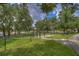 Fenced dog park with shaded seating at 17721 Bright Wheat Dr, Lithia, FL 33547