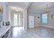 Bright and spacious entryway with tiled floors and a large door at 17721 Bright Wheat Dr, Lithia, FL 33547