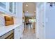 Butler's pantry with white shaker cabinets and quartz countertops at 17721 Bright Wheat Dr, Lithia, FL 33547