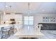 Bright kitchen with white cabinets, stainless steel appliances, and an island at 17721 Bright Wheat Dr, Lithia, FL 33547