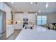 Modern kitchen with stainless steel appliances and white cabinetry at 17721 Bright Wheat Dr, Lithia, FL 33547
