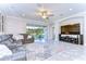 Spacious living room featuring a sectional sofa and large TV at 17721 Bright Wheat Dr, Lithia, FL 33547