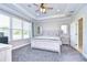 Large main bedroom with coffered ceiling, en-suite bathroom, and large windows at 17721 Bright Wheat Dr, Lithia, FL 33547