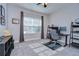Bright home office with a desk, chair, and built-in shelving at 17721 Bright Wheat Dr, Lithia, FL 33547
