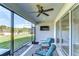 Relaxing screened porch with comfy seating and ceiling fan at 17721 Bright Wheat Dr, Lithia, FL 33547