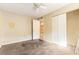 Bedroom with ceiling fan and access to other rooms at 203 Poinsettia Pine Ct # 201, Tampa, FL 33612