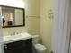 Clean bathroom with single sink vanity and toilet at 214 Elmwood Cir # 214, Seminole, FL 33777