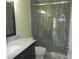 Updated bathroom with a walk-in shower and marble vanity at 214 Elmwood Cir # 214, Seminole, FL 33777