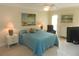 Bright bedroom with ensuite bathroom and double bed at 214 Elmwood Cir # 214, Seminole, FL 33777