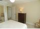 Simple bedroom with dresser and closet at 214 Elmwood Cir # 214, Seminole, FL 33777