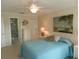 Comfortable bedroom with ensuite bathroom and beach-themed decor at 214 Elmwood Cir # 214, Seminole, FL 33777