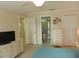 Well-lit bedroom with access to a shared bathroom at 214 Elmwood Cir # 214, Seminole, FL 33777