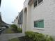 View of building exterior showcasing architectural details and landscaping at 214 Elmwood Cir # 214, Seminole, FL 33777