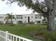 Front view of the building, showcasing its architectural style and landscaping at 214 Elmwood Cir # 214, Seminole, FL 33777