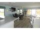 Bright community room with dining area and pool view at 214 Elmwood Cir # 214, Seminole, FL 33777