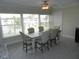 Bright dining room with table and chairs, overlooking a view at 214 Elmwood Cir # 214, Seminole, FL 33777