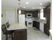 Modern kitchen featuring granite countertops and stainless steel appliances at 214 Elmwood Cir # 214, Seminole, FL 33777