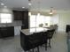 Open concept kitchen with island and breakfast bar seating at 214 Elmwood Cir # 214, Seminole, FL 33777