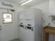 Laundry room with stackable washers and dryers at 214 Elmwood Cir # 214, Seminole, FL 33777