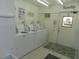 Clean laundry room with several washers and dryers at 214 Elmwood Cir # 214, Seminole, FL 33777