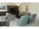 Relaxing living room with plush seating and built-in shelving at 214 Elmwood Cir # 214, Seminole, FL 33777