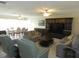Spacious living room with ample seating and built-in entertainment center at 214 Elmwood Cir # 214, Seminole, FL 33777