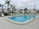 Inviting community pool with plenty of lounge chairs at 214 Elmwood Cir # 214, Seminole, FL 33777