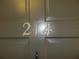 Close-up of the unit number, 214, on the apartment door at 214 Elmwood Cir # 214, Seminole, FL 33777
